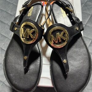 Michael Kors Black Leather Thong Sandals with Gold MK Medallions